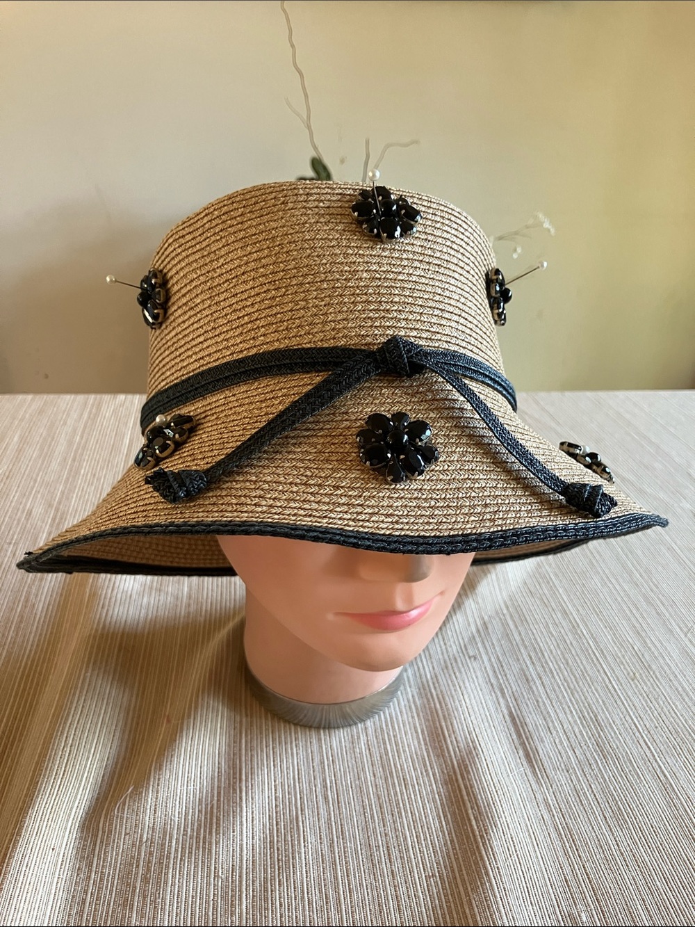 Embellished Straw Sun Hat with Black Trim and Floral Accents